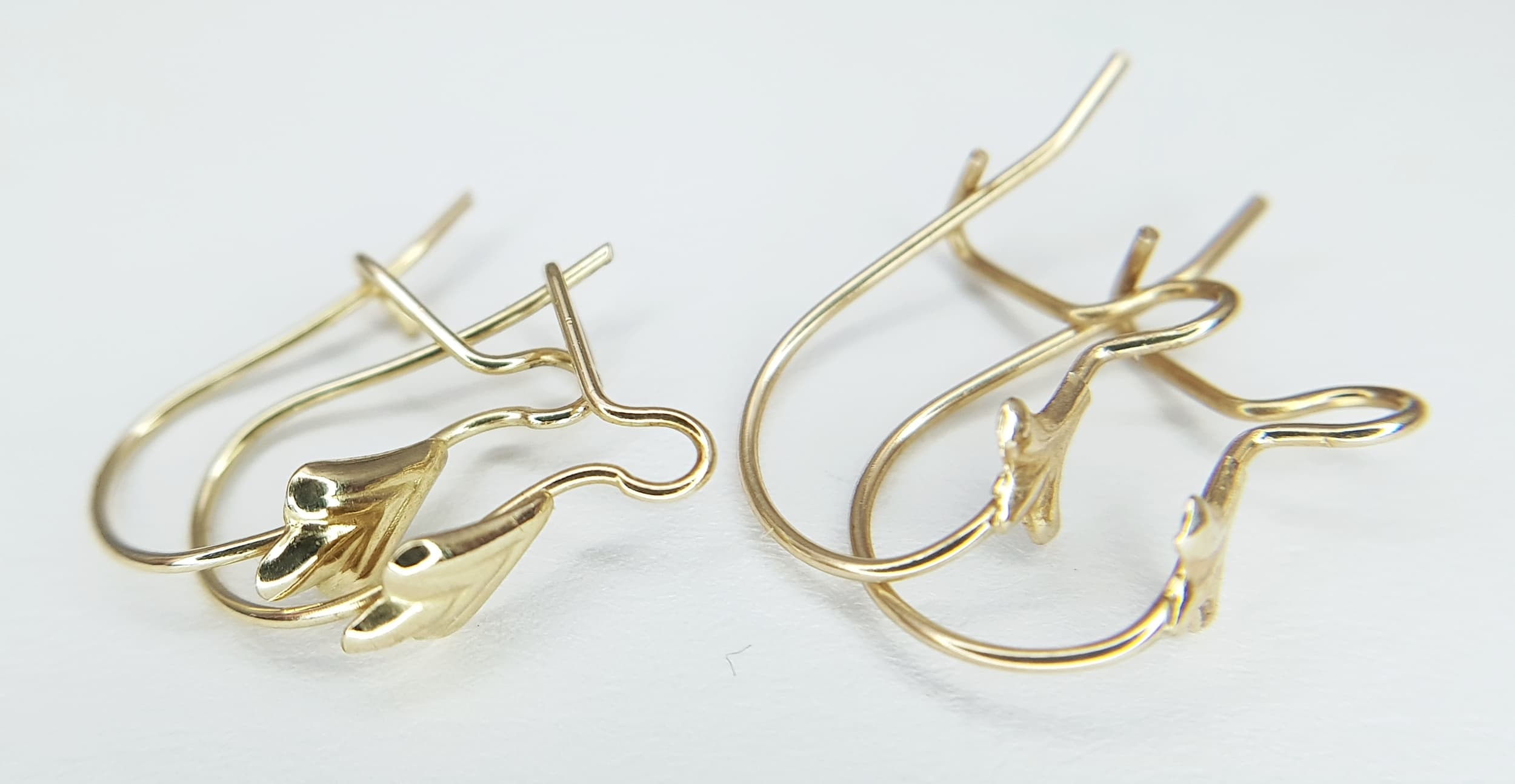 Two Pairs of 9K Gold (tests as) Thin Huggie Earrings. 0.6g.