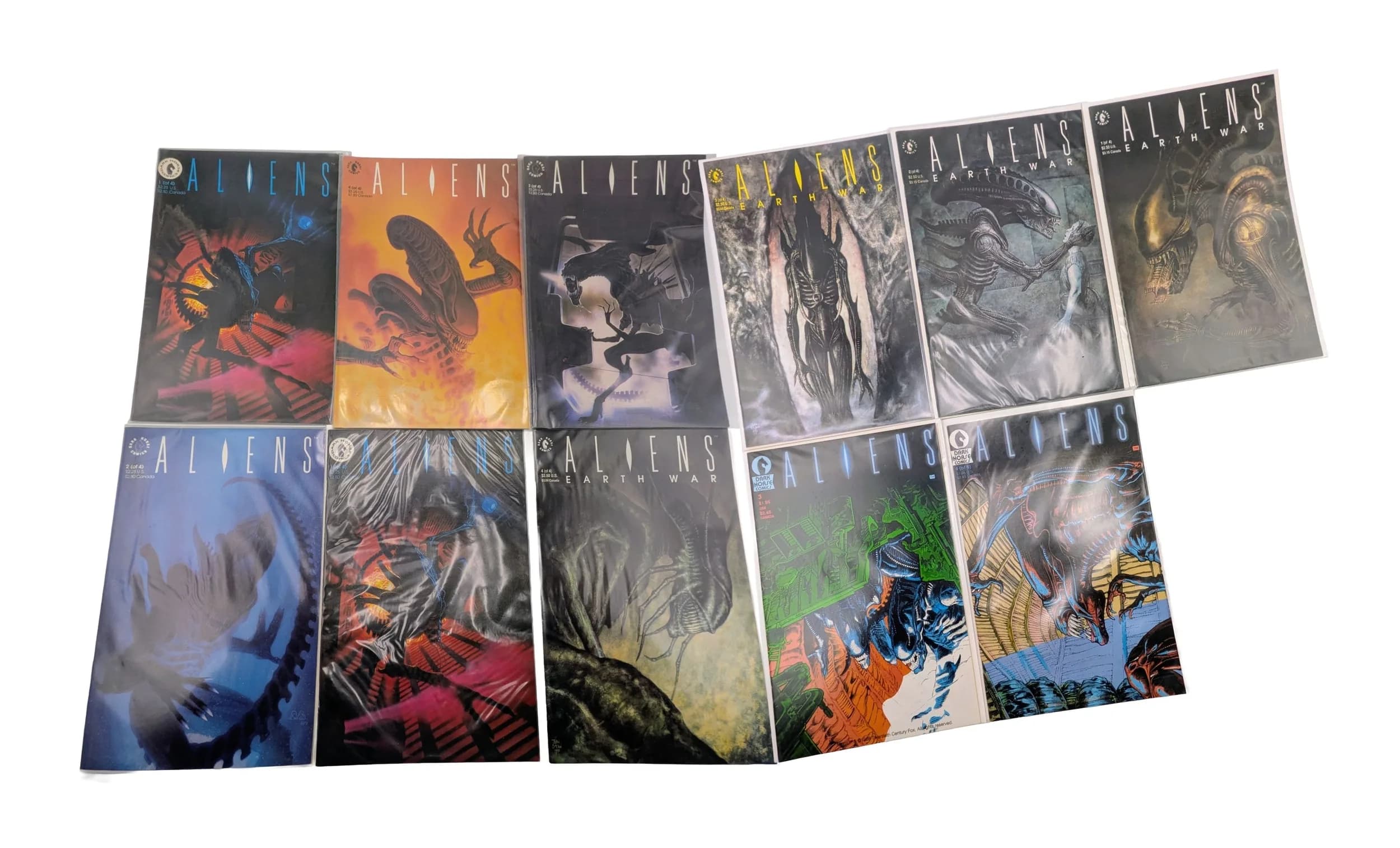 Ten Dark Horse Aliens Comics. All plastic wrapped. Please refer to photos for finer details.