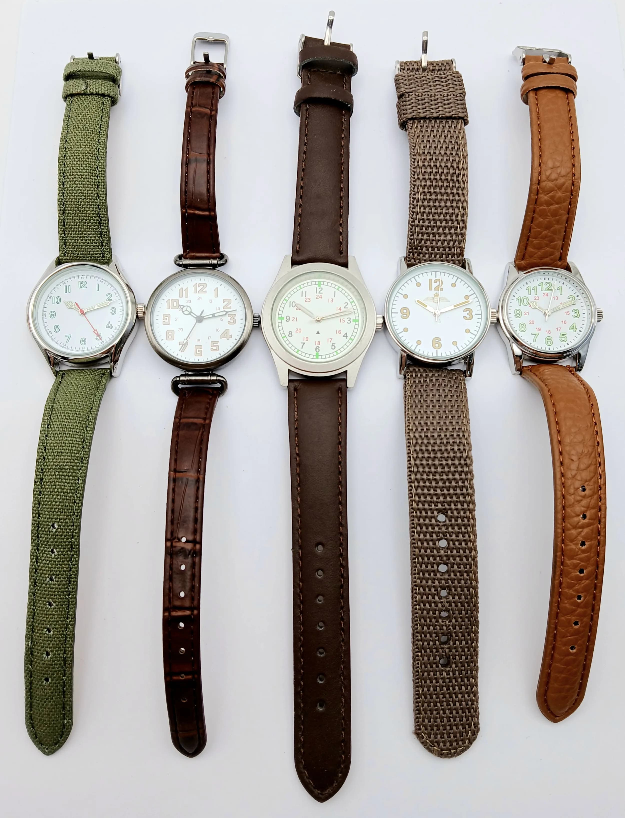 A Parcel of Five Military Style Watches Comprising: 1) UK Paratrooper-36mm Case, 2) Japanese Army-30mm Case, 3) Canadian Airforce-32mm case, 4) United States Expeditionary Force-34mm Case & 5) Indian Army-34mm Case. All have had battery replacements May 2026.