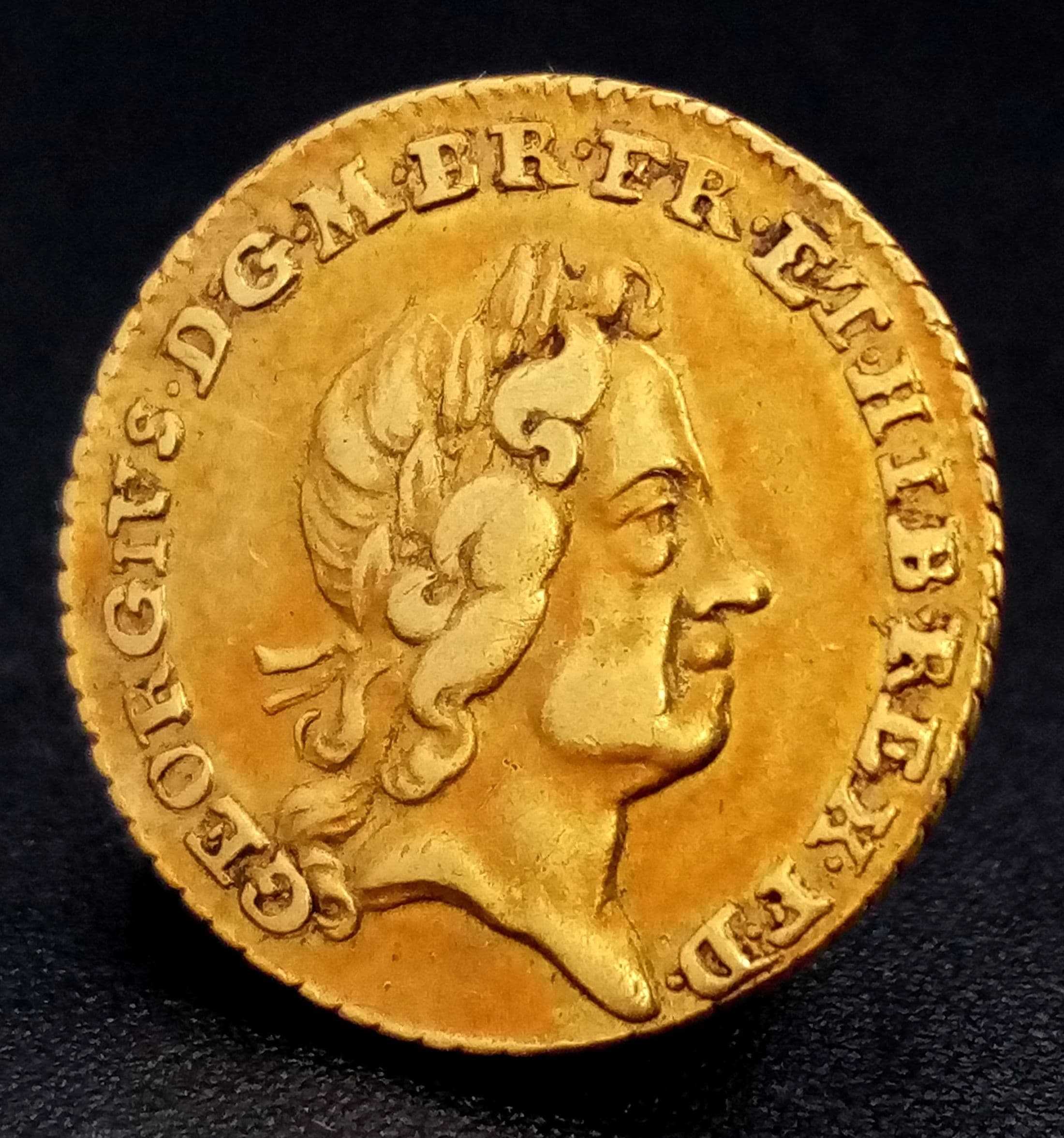A 1718 George I Quarter Guinea Coin. 22k Gold. EF.