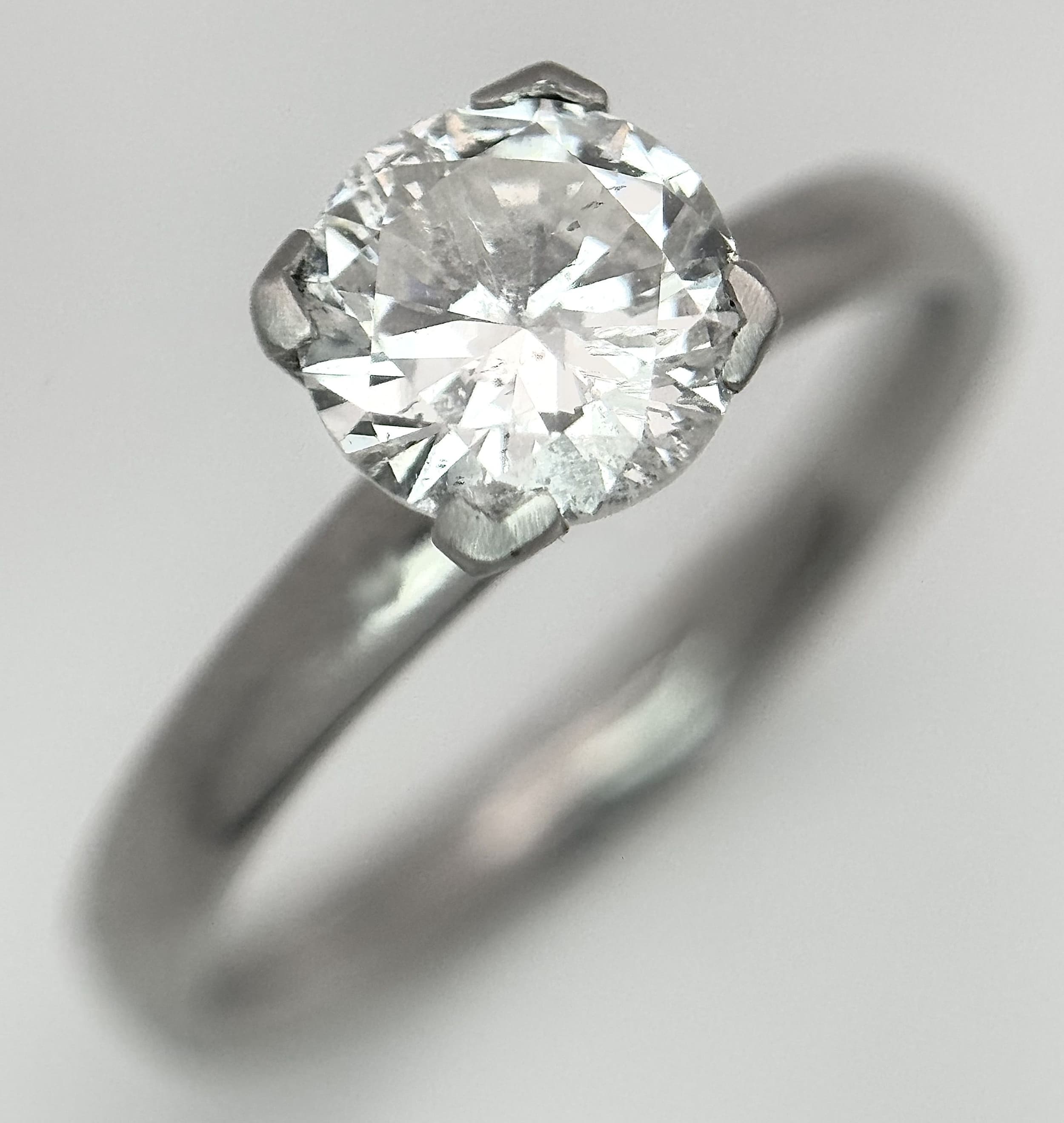 A W.G.I Certified 950 Platinum and Diamond Solitaire Ring. A 0.80ct round brilliant cut diamond having H colour and SI2 clarity. 3.4g total weight. Ref: 9/63006.