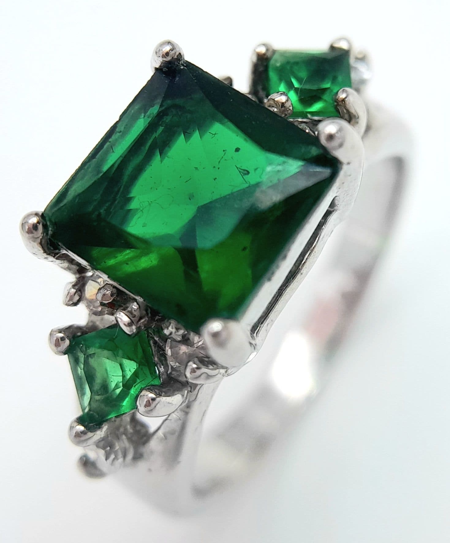 Attractive SILVER RING set with GREEN GARNET GEMSTONES. Having Square Cut Centre Stone with additional Green Garnets and Zirconias to Shoulders. Size L 1/2. Beautiful Ring , Please see pictures.