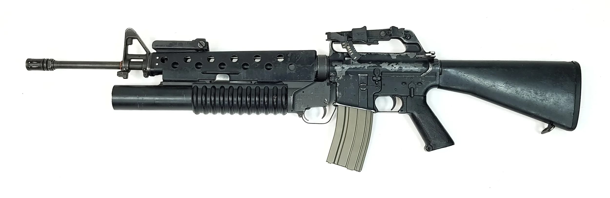 "Say Hello To My Little Friend" - A Colt M16A1 with M203 Grenade Launcher. The same set-up used in the iconic final scene in Scarface. Actually, this is better as the grenade launcher in the movie was faux (prop department). Both deactivated with certificates. The colt assault rifle has a 5.46mm calibre and 20 inch barrel length. The grenade launcher has a 40mm calibre with a 12 inch barrel length. The only thing missing is the gaffer tape and spare magazine! EU and UK sales only - Not Holland. UK Mainland Shipping Only