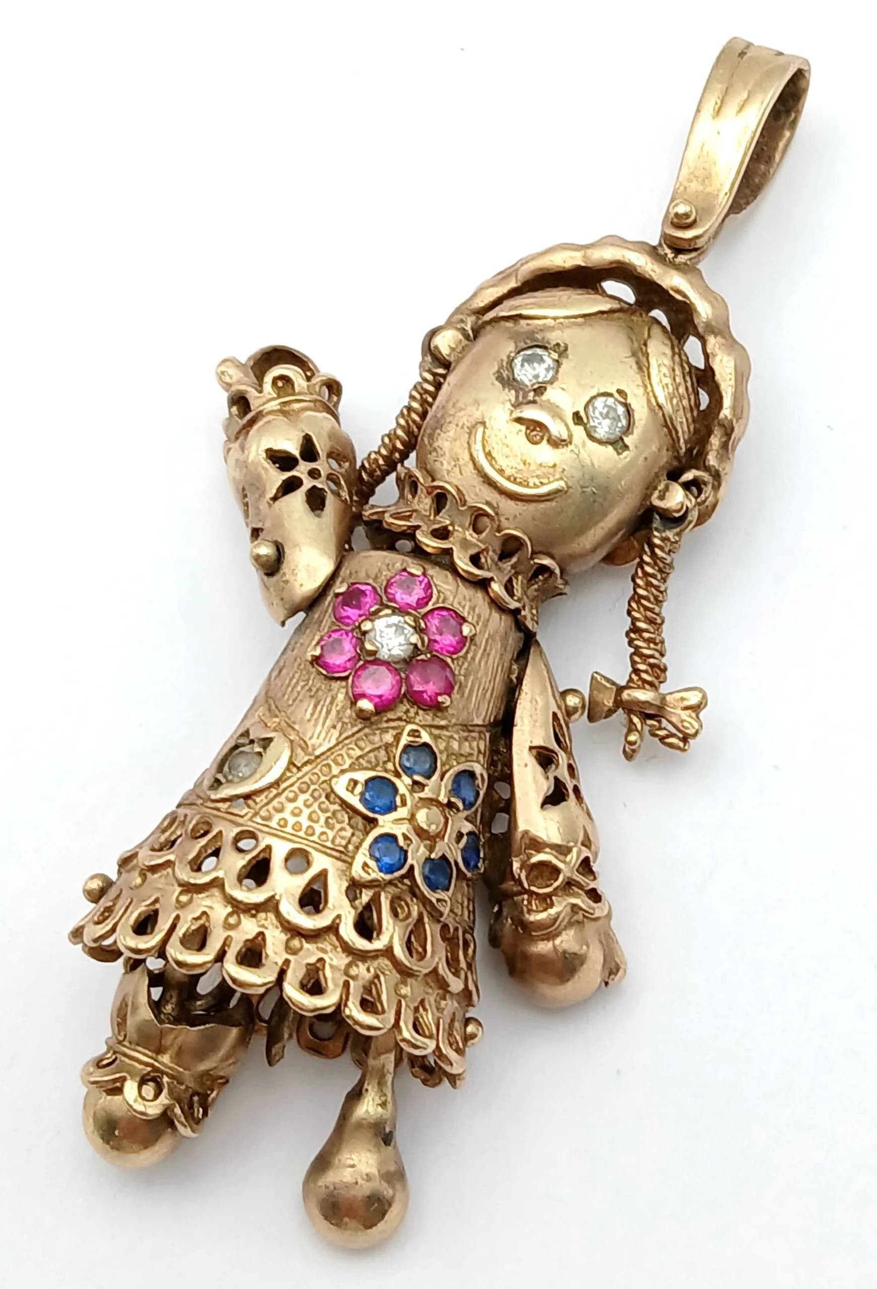 A 9K GOLD LOOBY LOO PENDANT DECORATED WITH DIAMONDS , SAPPHIRE AND RUBY STONES . 15,3gms 6cms