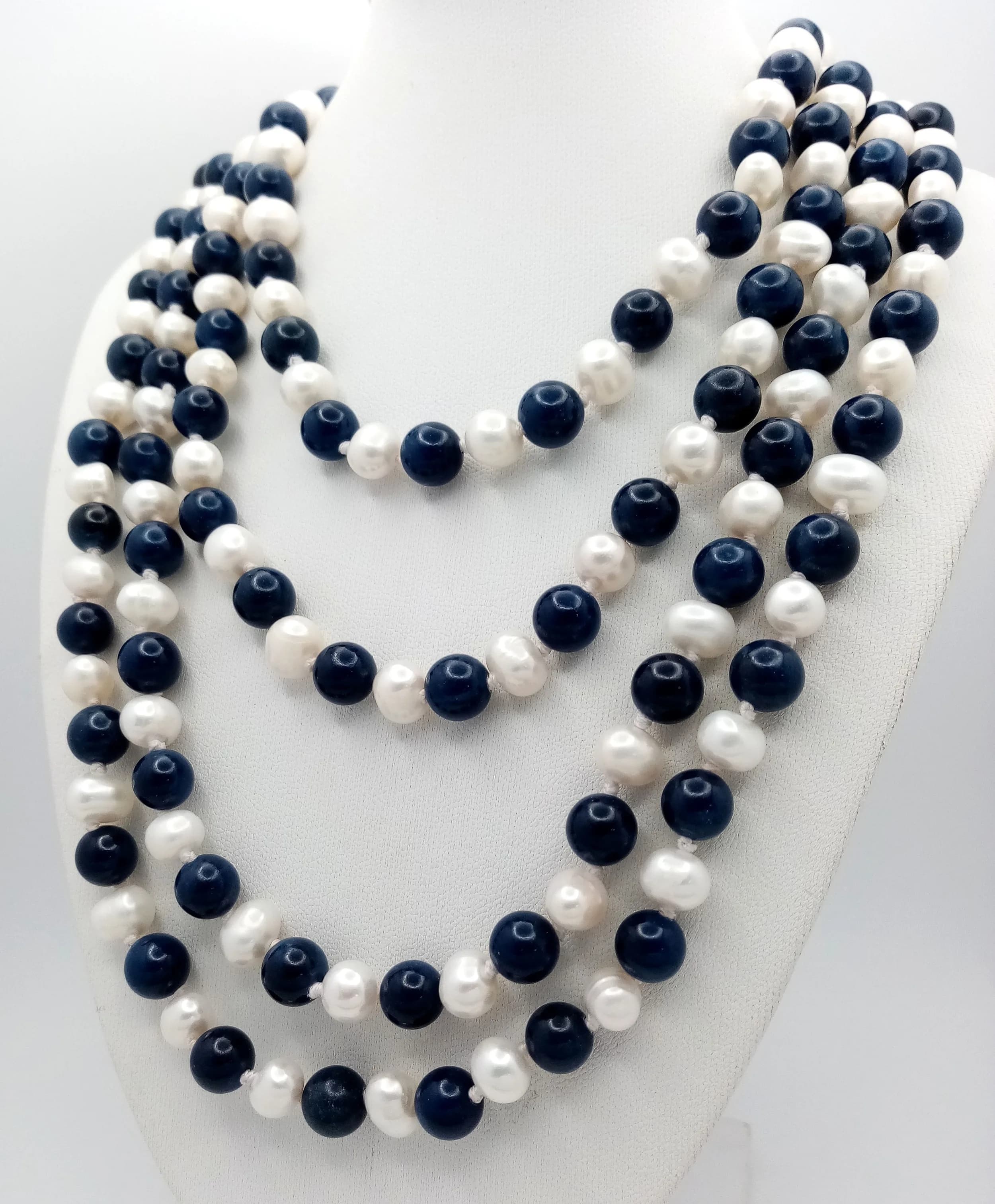 A Rope Length Pearl and Lapis Lazuli Necklace. 170cm necklace length. 7/8mm pearls and lapis.