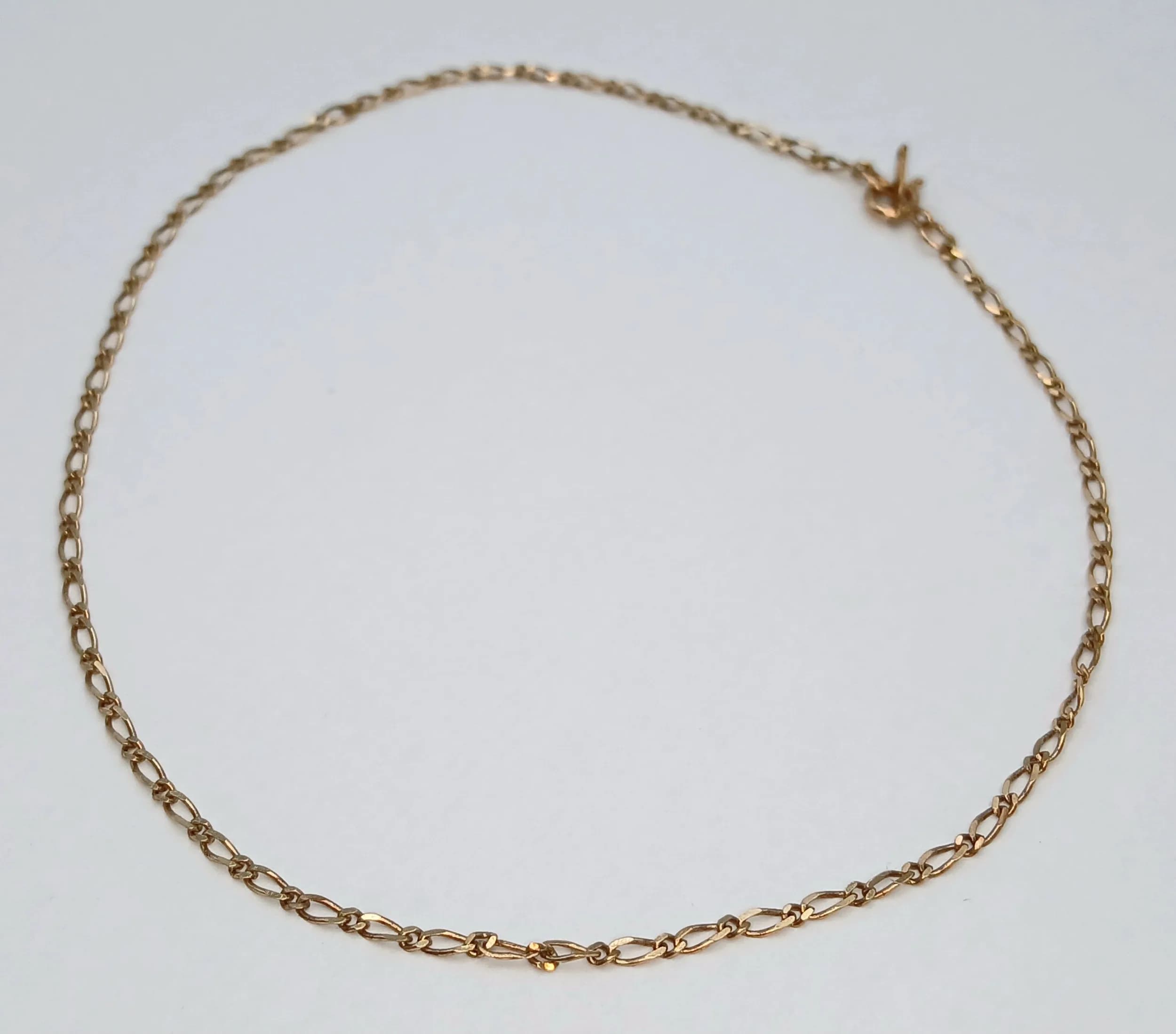 A 9K GOLD DAINTY 22cms BRACELET OR ANKLET . .9gm