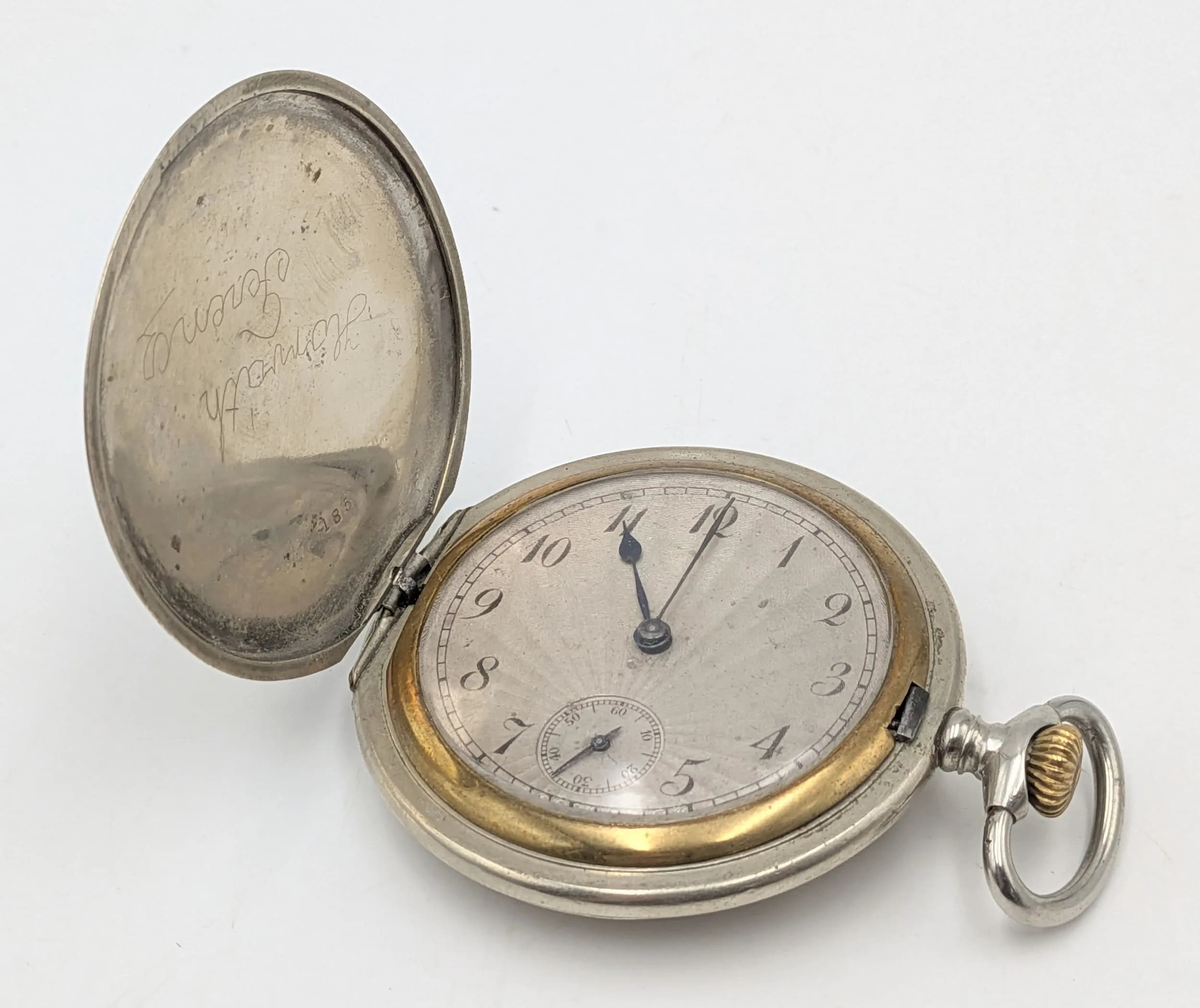 WW2 Belgian Made Pocket Watch in a full hunter case. A 3rd Reich Broken Cross Swastika has been soldiered onto the back. The infamous 5th SS Panzer Division also used this symbol as their Division Logo. Works well.