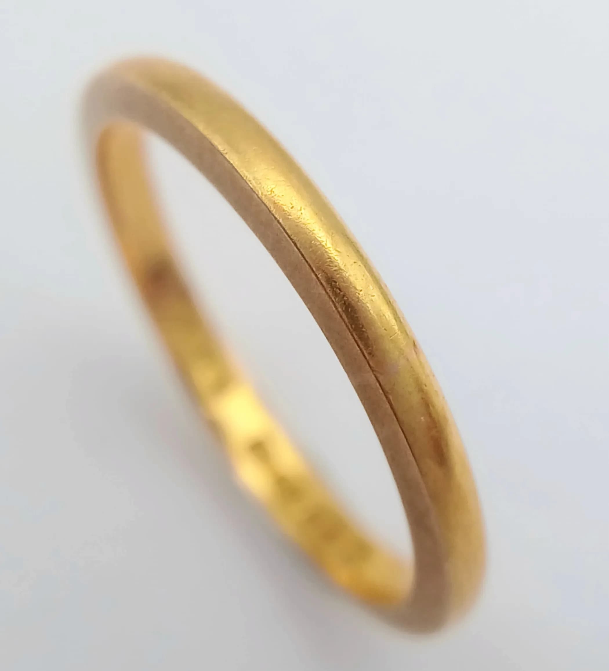 A 22K Yellow Gold Band Ring. UK hallmarks. 3mm width. Size L. 2.65g.