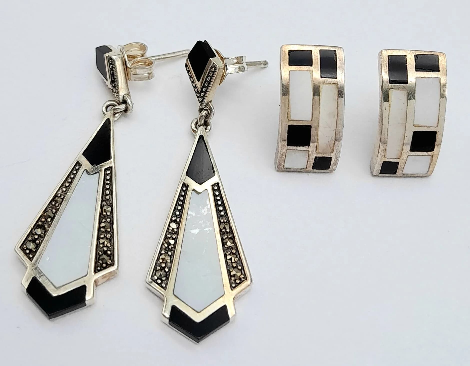 Two Pairs of Very Attractive Vintage Sterling Silver Black and White Onyx Art Deco Design Earrings. The Pendant pair measure 3.5 x 1cm and the curved stud pair measure 15 x 8mm.