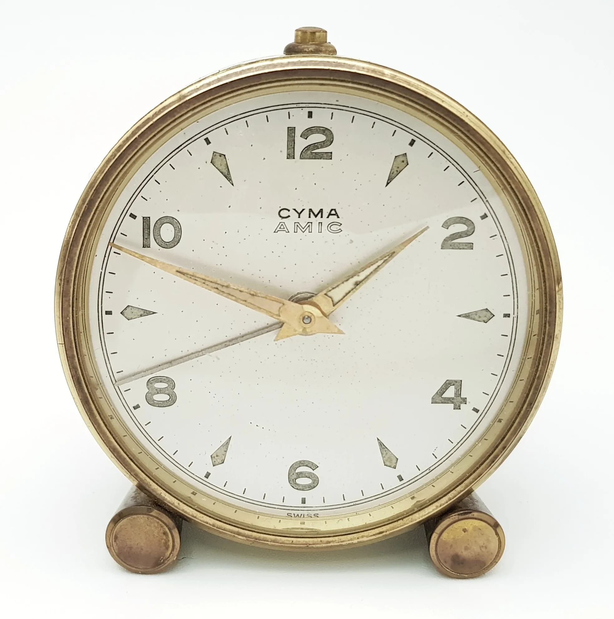 A Vintage Cyma Desk Clock. In working order. 6cm diameter.
