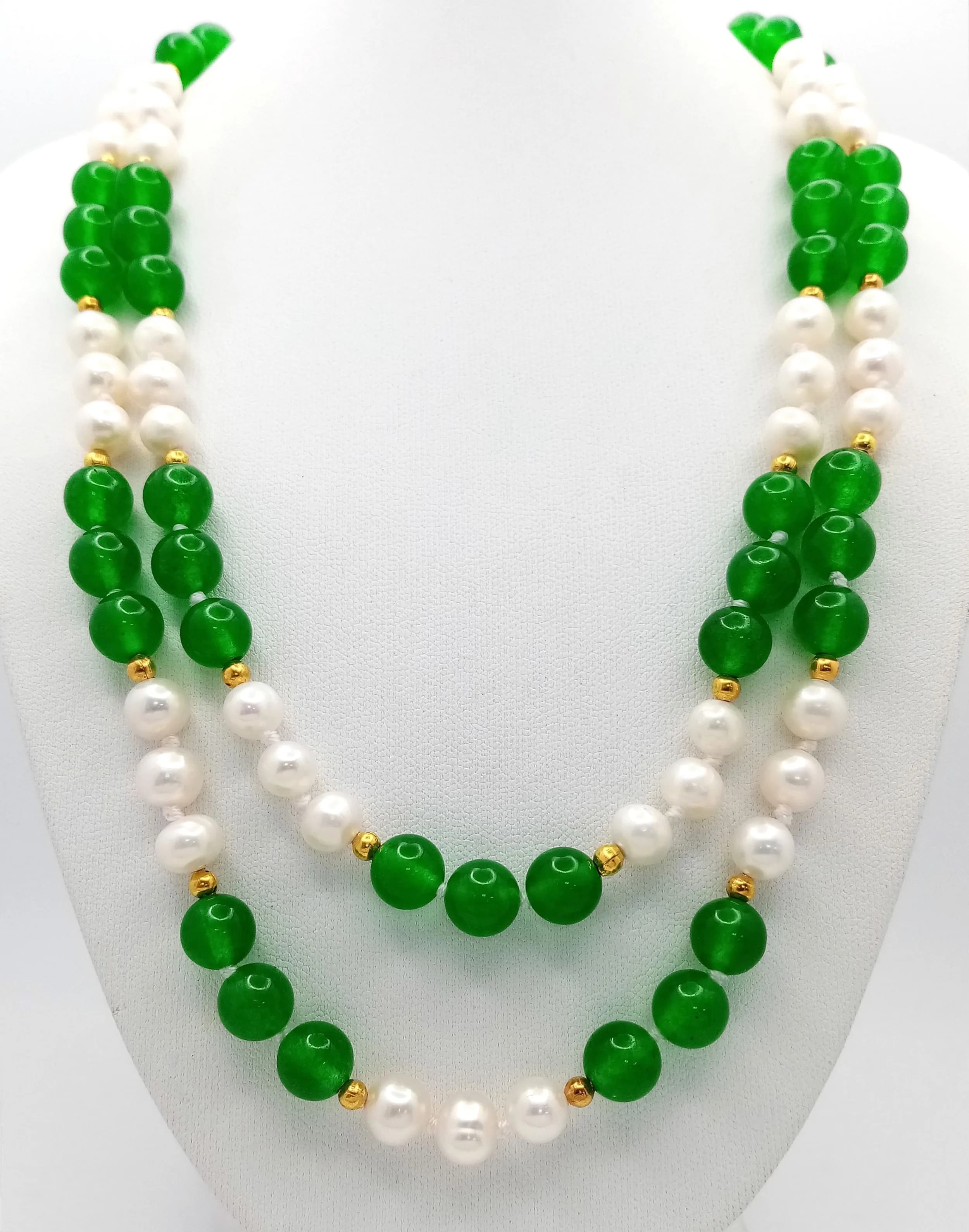 A Green Jade and Freshwater Pearl Necklace. 7/8mm pearls and jade. 90cm length.