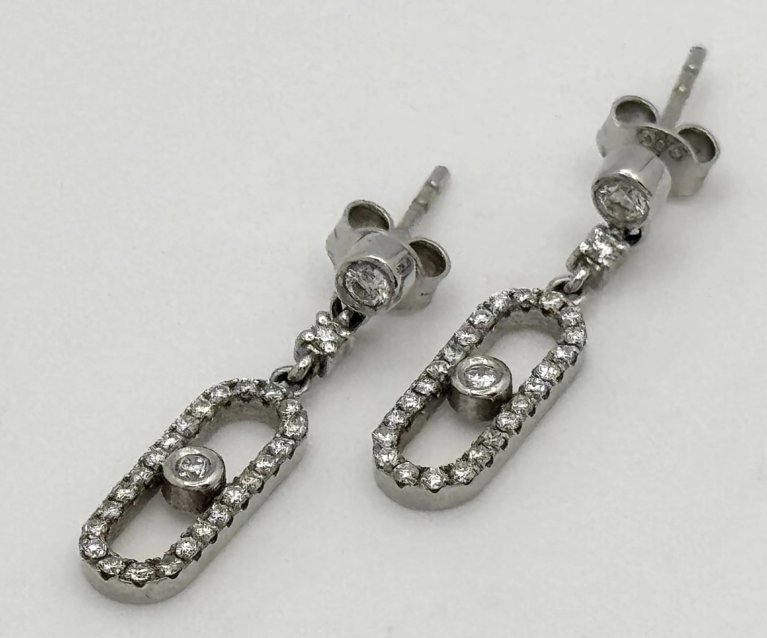 A Pair of 14K White Gold Move Uno Style Drop Earrings, Complete with 14K White Gold Butterfly Backs. Earrings Unhallmarked, Test as 14K, Butterfly Backs Hallmarked 585. Total Weight 2.59 Grams. Ref: 3-7