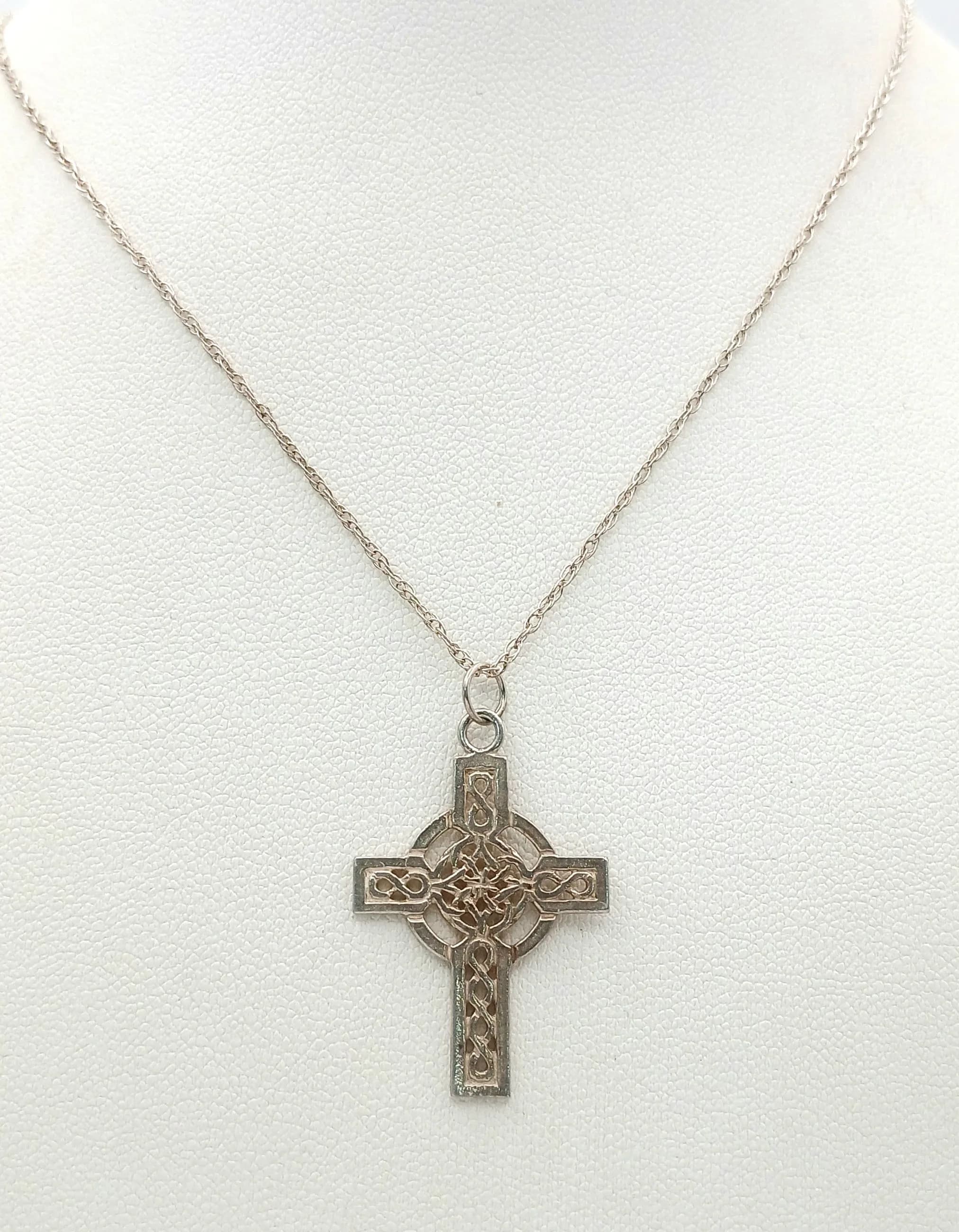 A Vintage Sterling Silver Intricate Open Work Celtic Cross Pendant Necklace. 46cm Length Chain. The Cross measures 3 x 2cm. The Necklace weighs 2.47 grams.