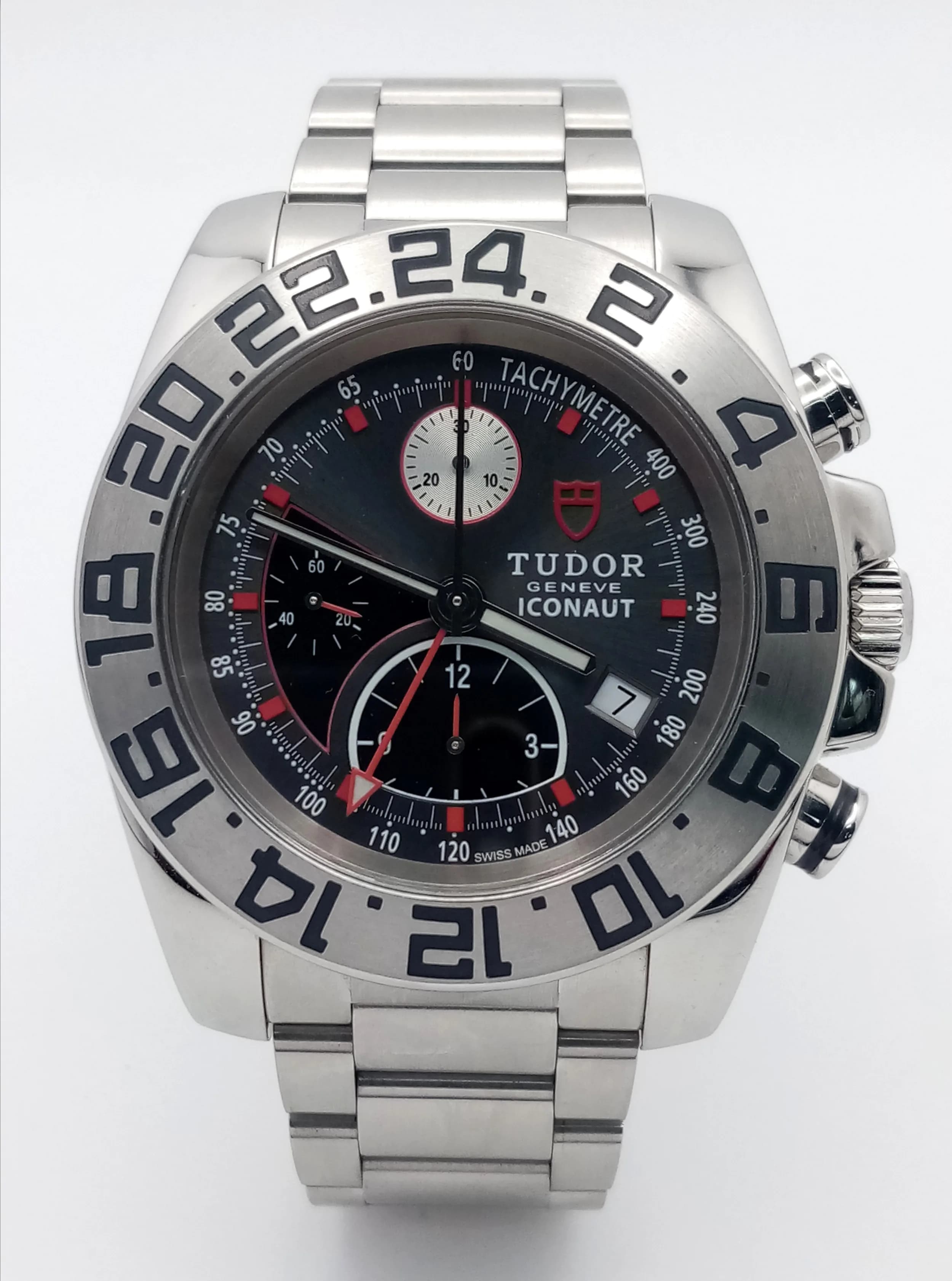 A Tudor Iconaut Automatic Chronograph Gents Watch. Stainless steel bracelet and case - 43mm. Silver tone dial with second time zone and three sub dials. Twenty-four hour bezel. In very good condition and working order.