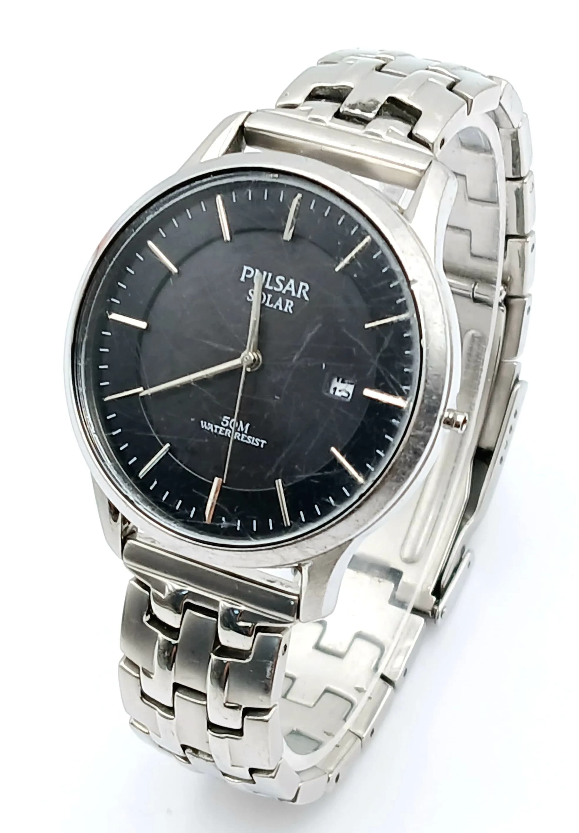 A PULSAR, SOLAR POWERED, BLACK DIAL, STEEL BRACELET WATCH, WITH DATE FUNCTION. IN WORKING ORDER, NEW BATTERY FITTED RECENTLY. S/A 1684 - 2