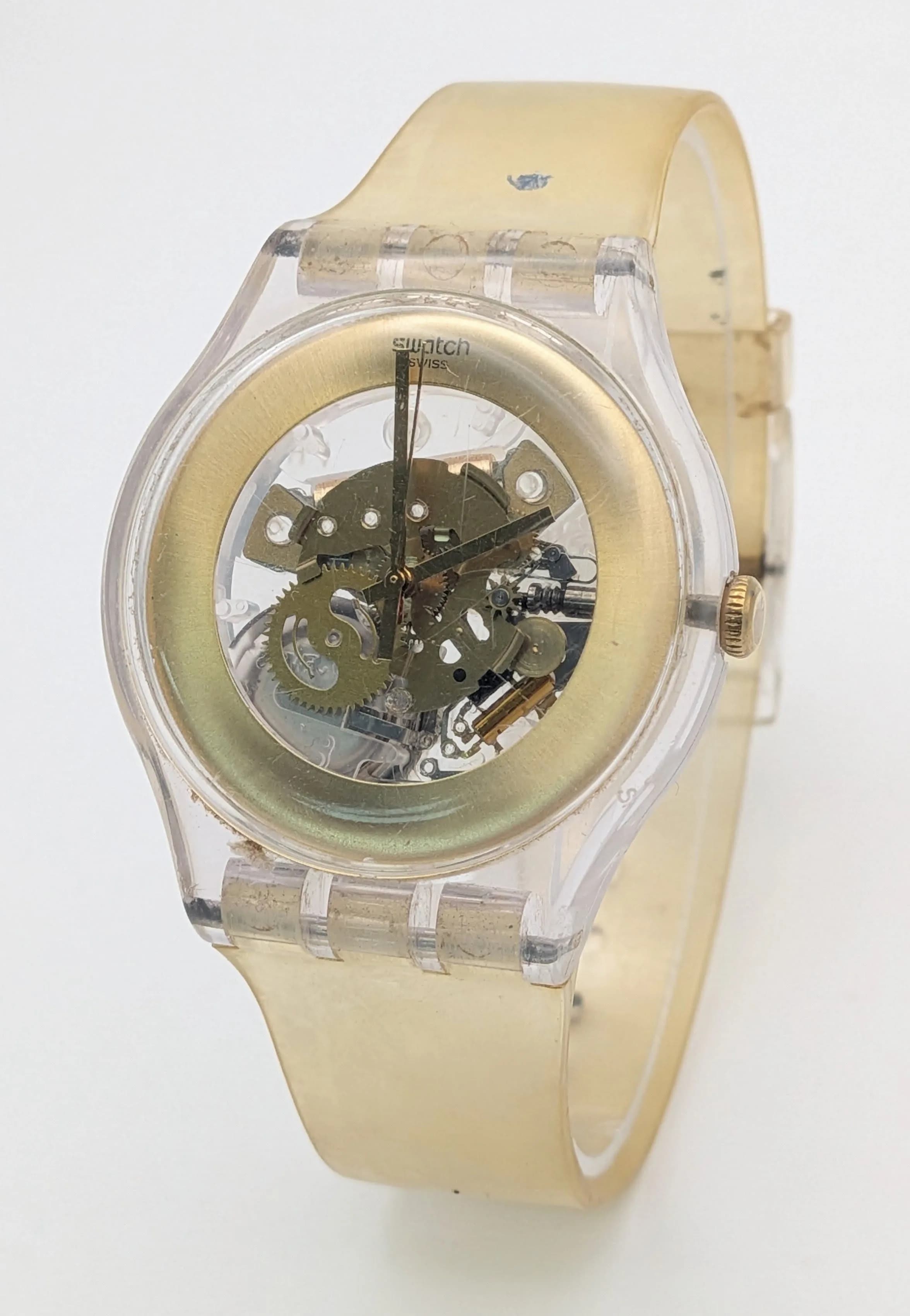 A SWATCH, GILT GHOST, RUBBER STRAP WATCH