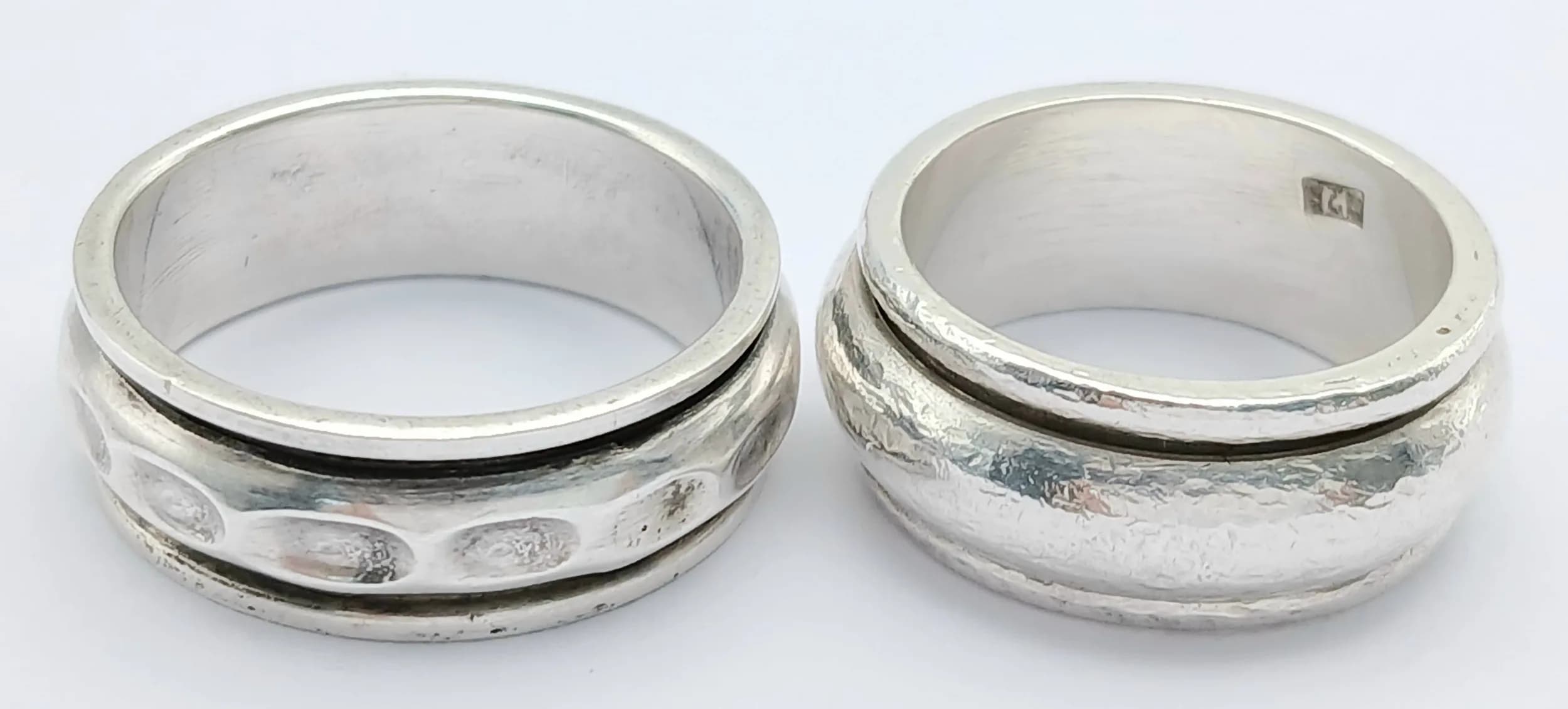 Two Silver Spinner Rings