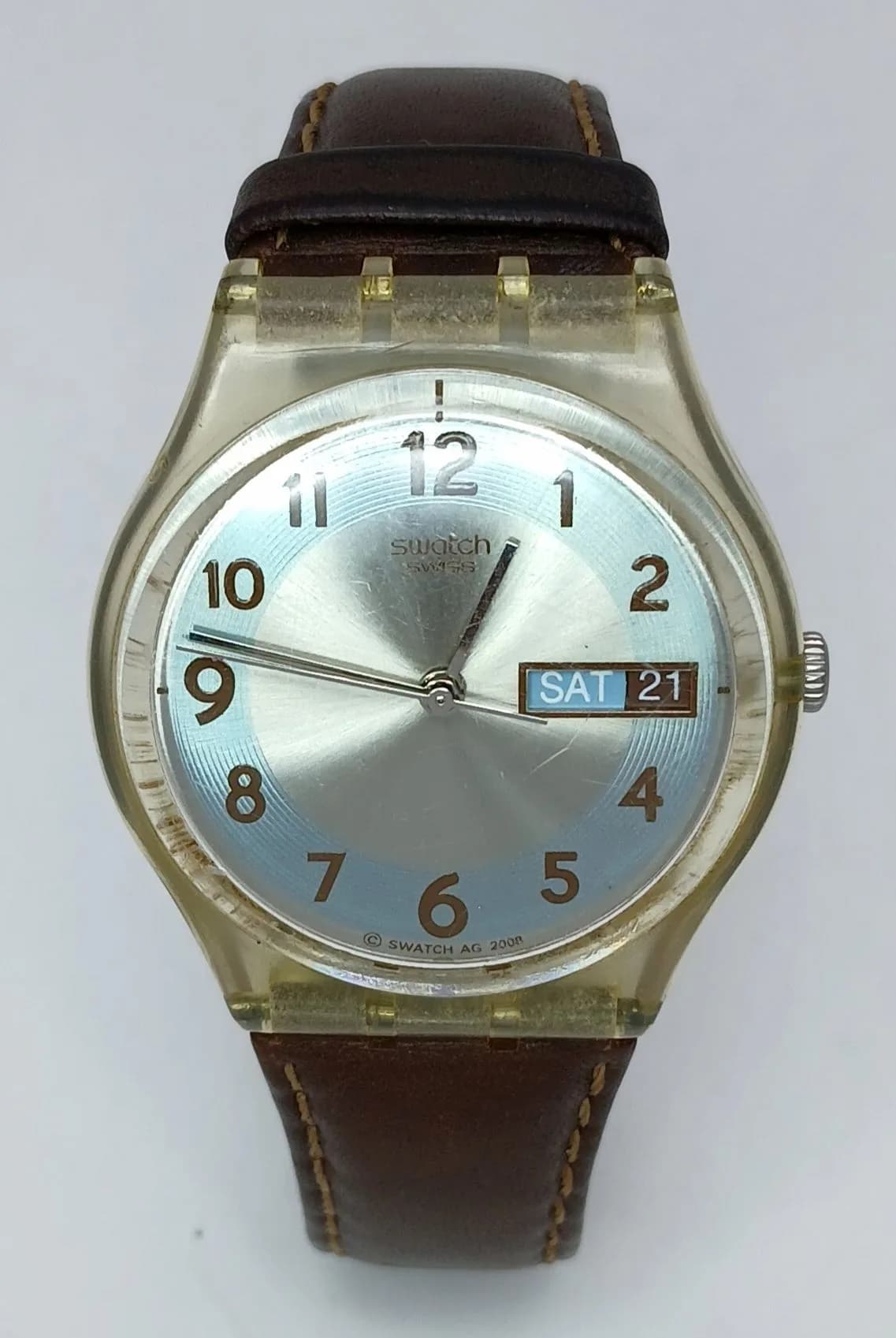 A SWATCH, DAY DATE FUNCTION, BLUE CONKER, BROWN LEATHER STRAP WATCH