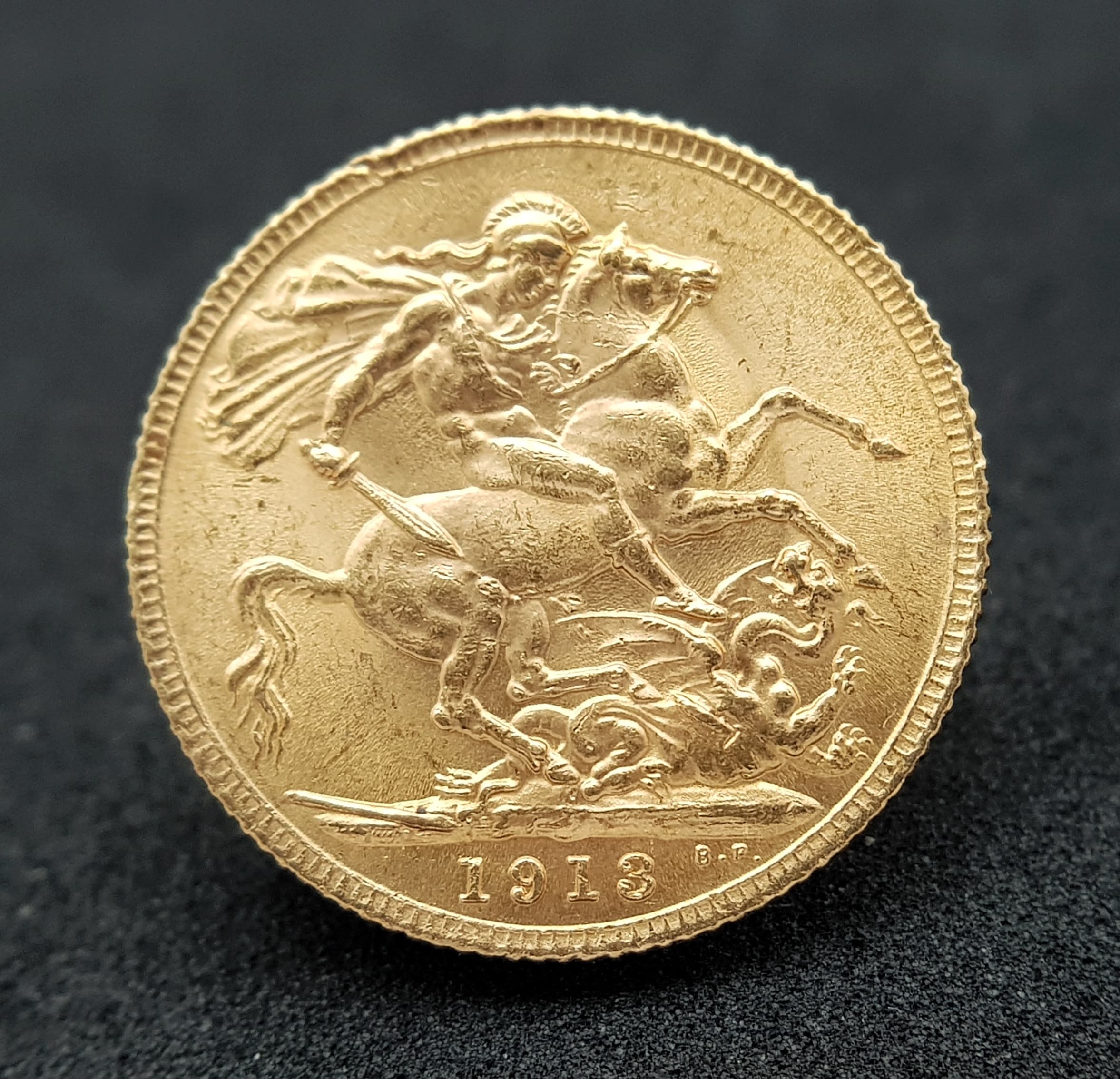 A 1913 George V Full Sovereign Coin. 22k Gold. Good definition.