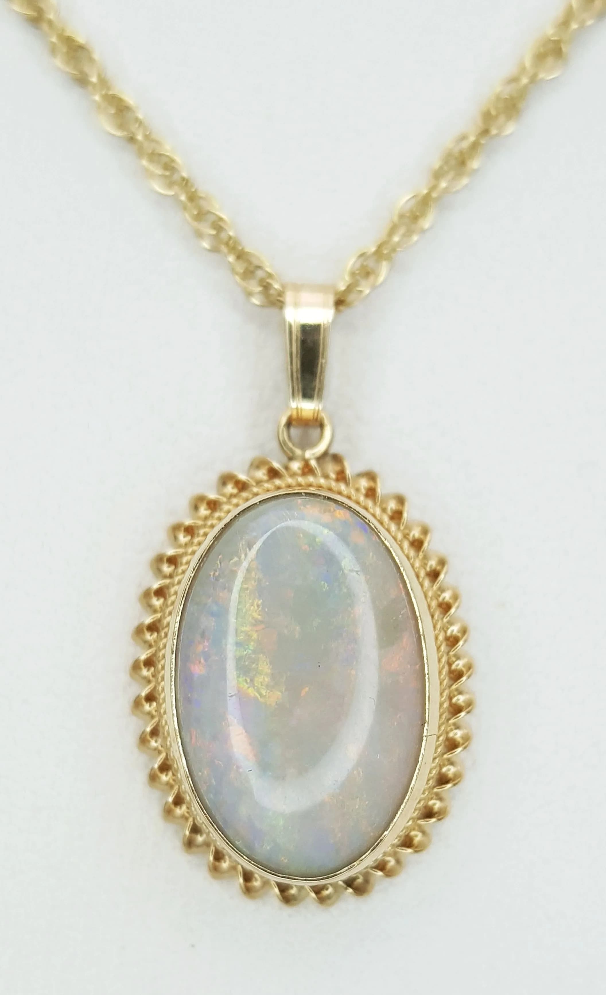 A 9K Yellow Gold Opal Pendant on a 9K Yellow Gold Chain