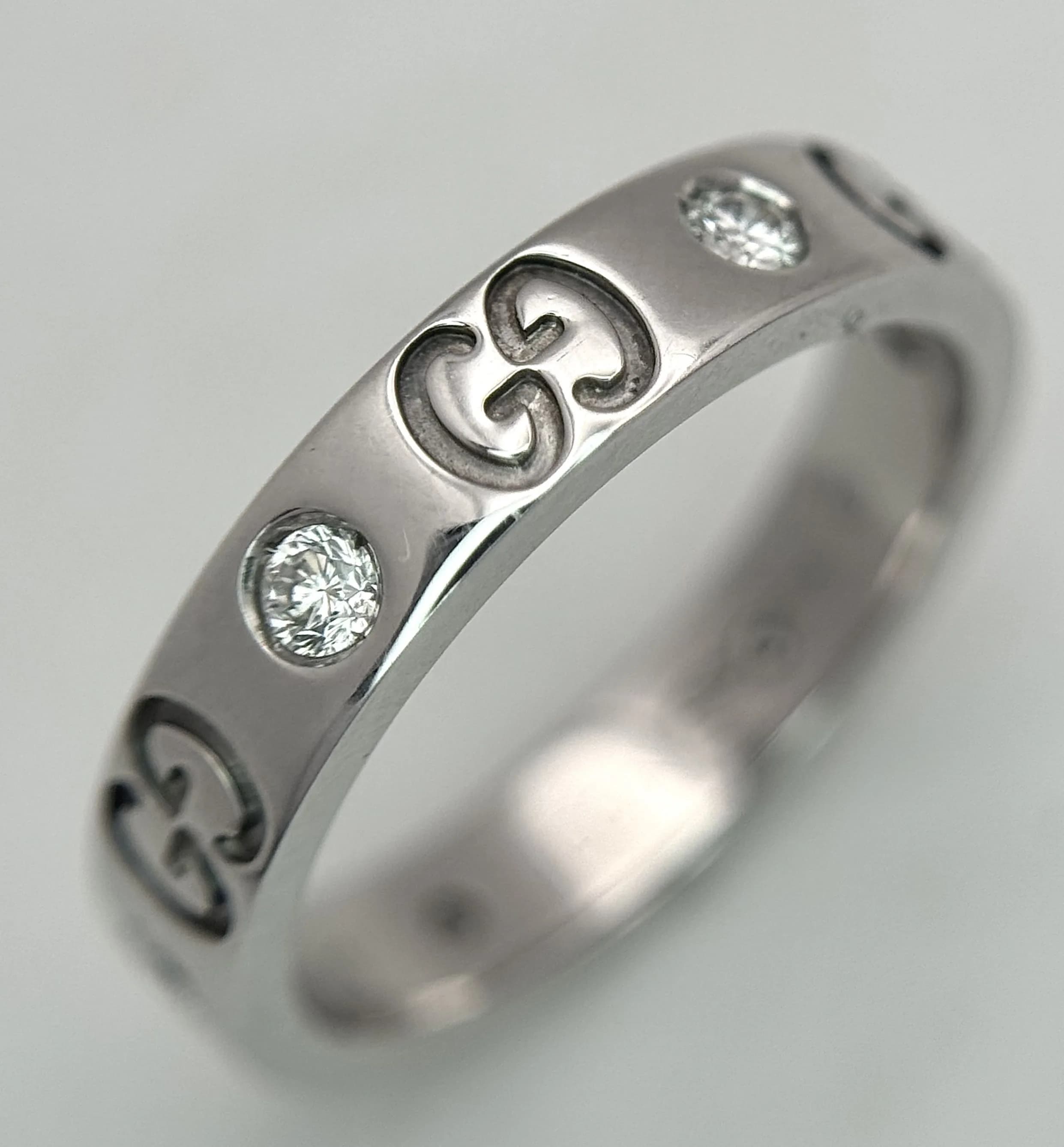 A Gucci Designer 18K White Gold and Diamond Band Ring