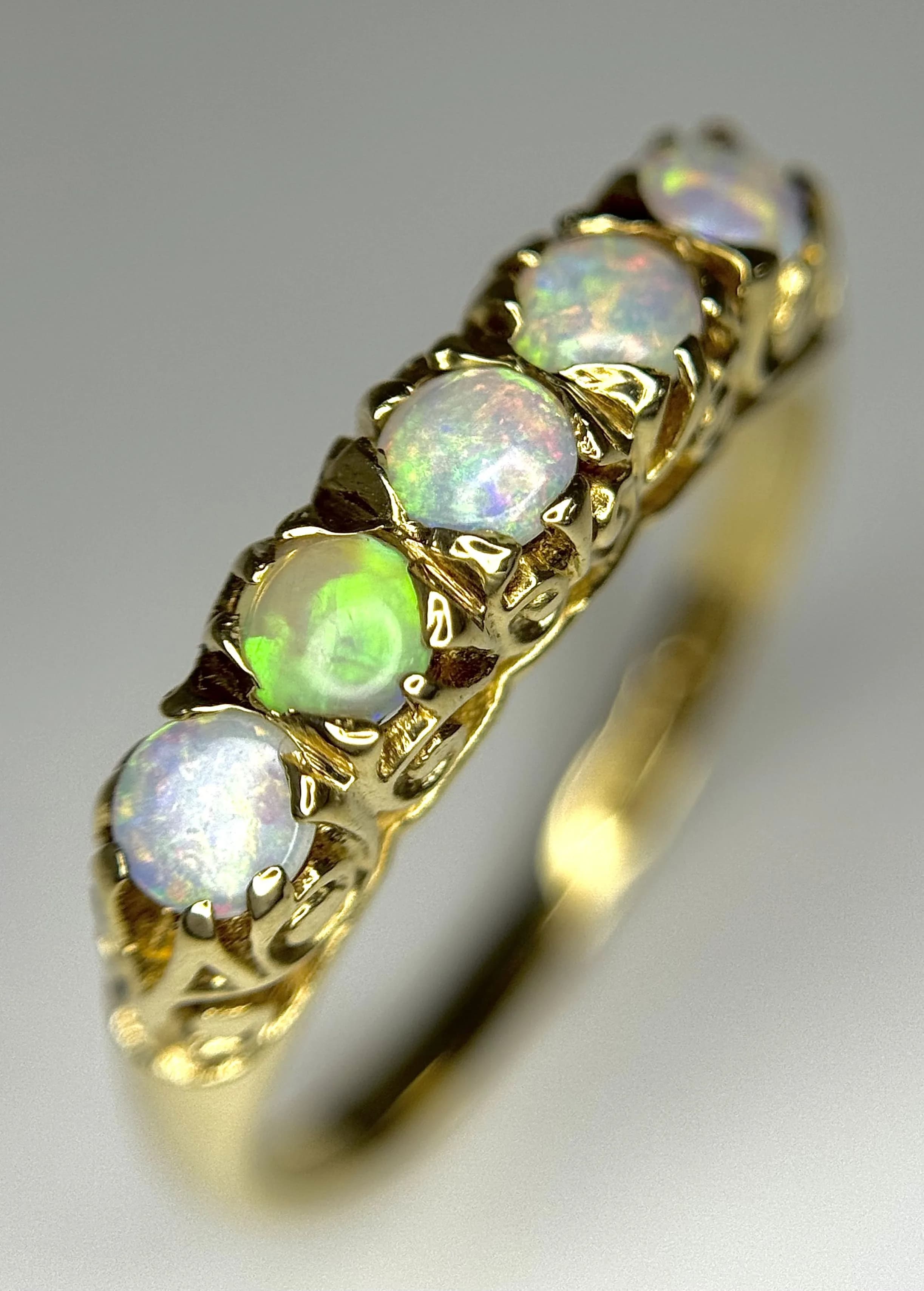 A 9K Yellow Gold Five Stone Opal Ring